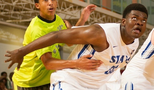 Udoka Azbuike boxes out basketball